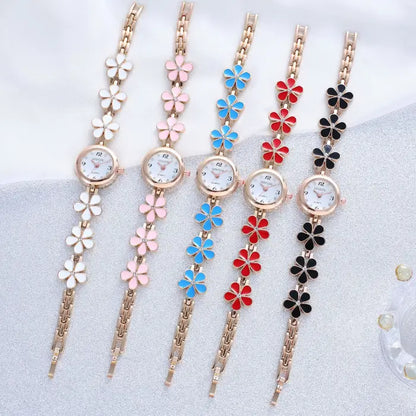 Women's watch bracelet set with multi-color flower designs in various shades.