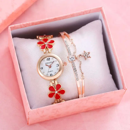 Women's watch bracelet set with red flower design in a pink gift box.