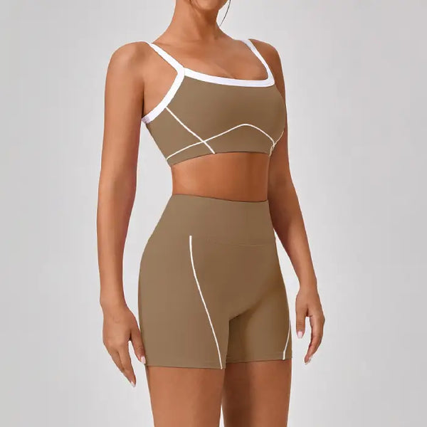 Women's workout set in brown featuring square-neck sports bra and high-waisted shorts with white contrast piping detail