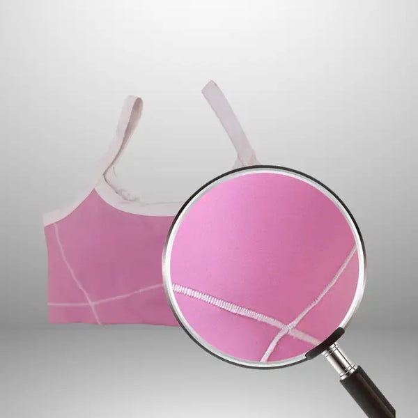 Women's workout set fabric close-up showing detailed white contrast stitching on pink breathable material