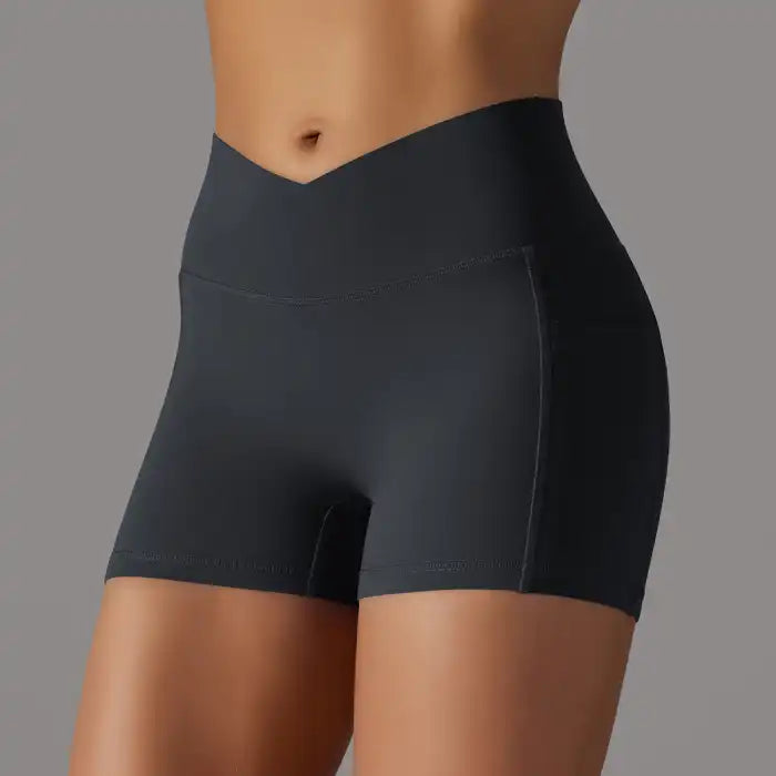 Womens yoga shorts in black with V waistband and seamless front fit, perfect for gym or home workouts.