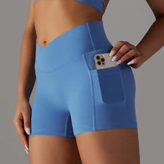 Womens yoga shorts in bright blue with flattering V waistband and side pocket to hold phone or keys.