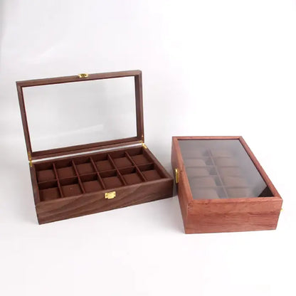 Open wooden watch storage case with compartments for watches and a glass display lid