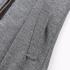 wool blend hooded coat pocket close-up showing textured fabric and clean stitching, highlighting premium winter outerwear quality