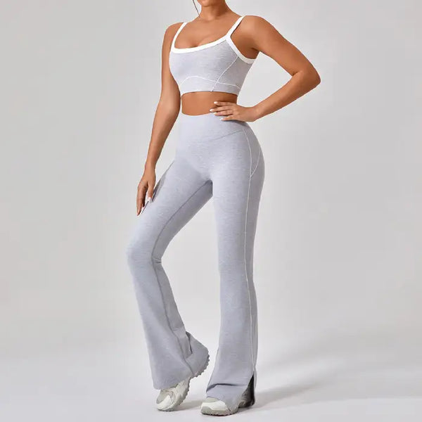 Workout clothes women in heather gray featuring square neck sports bra and high-waisted flared pants with white contrast trim