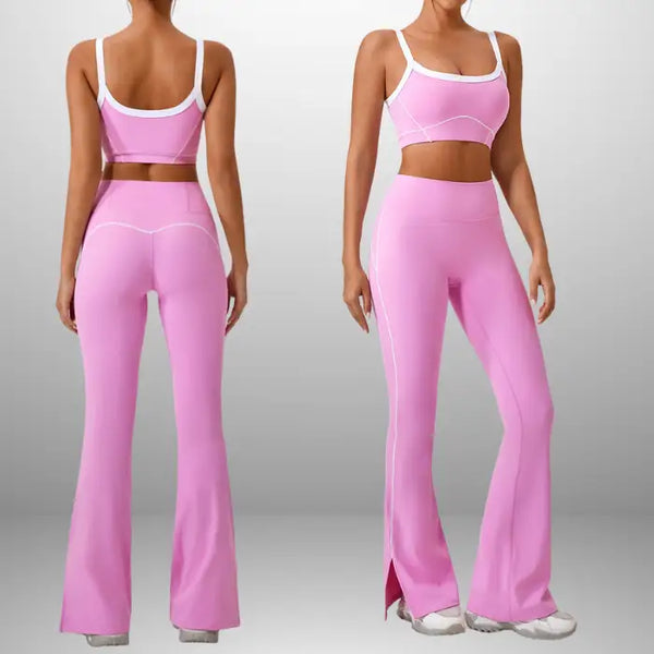 Workout clothes women in bright pink front and back featuring sports bra and high-waisted flared pants with white trim and side slit detail