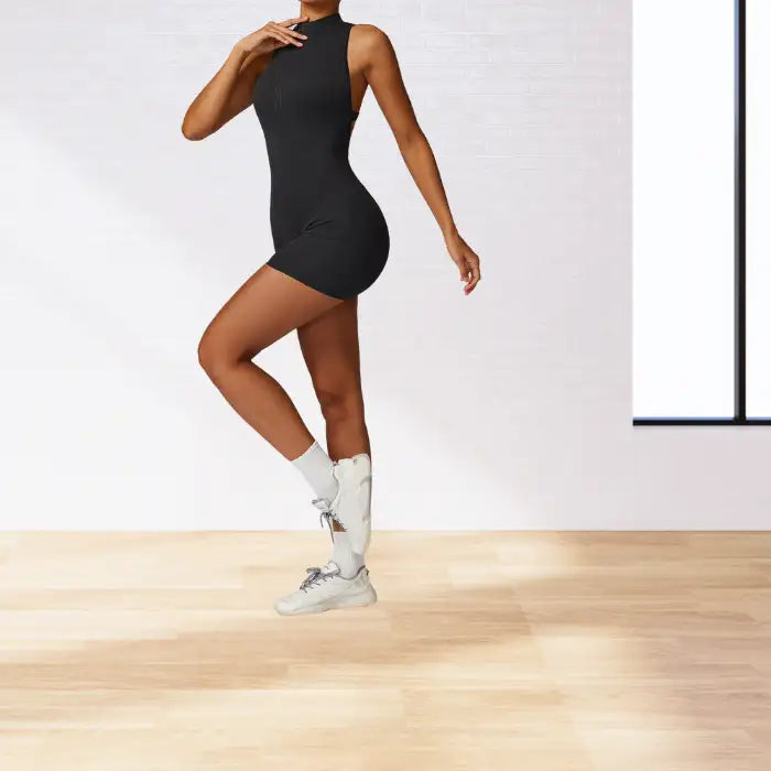 workout romper in classic black featuring sleek fitted silhouette with mock neck design ideal for high-intensity training