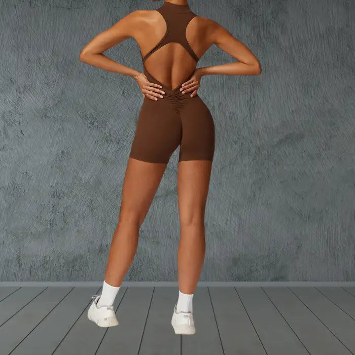 workout romper in chocolate brown with stylish open back design featuring ruched detail for enhanced comfort during exercise
