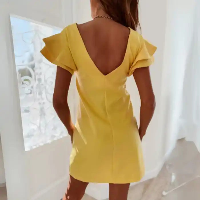 Yellow ruffle sleeve shift dress back view highlights V-back and layered sleeves.