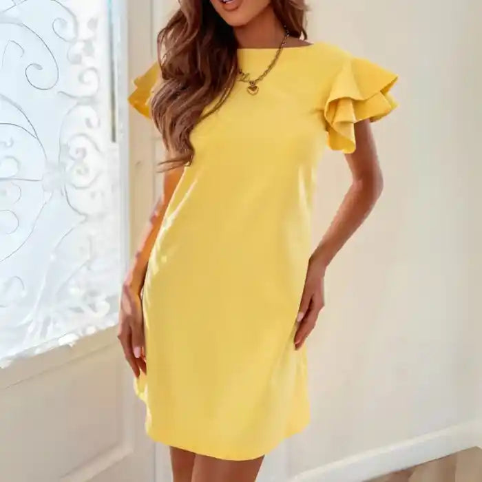 Yellow ruffle sleeve shift dress side view showing relaxed shift shape and flutter sleeves.