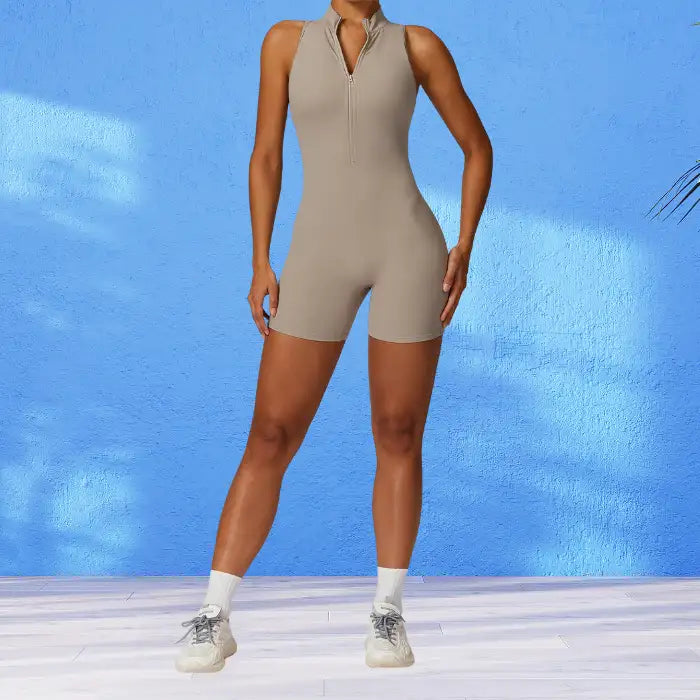 yoga bodysuit in versatile beige with front zipper design ideal for layering or solo wear during various yoga practices