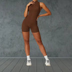 yoga bodysuit in rich brown with mock neck and zip closure offering sleek athletic compression for movement-based practices