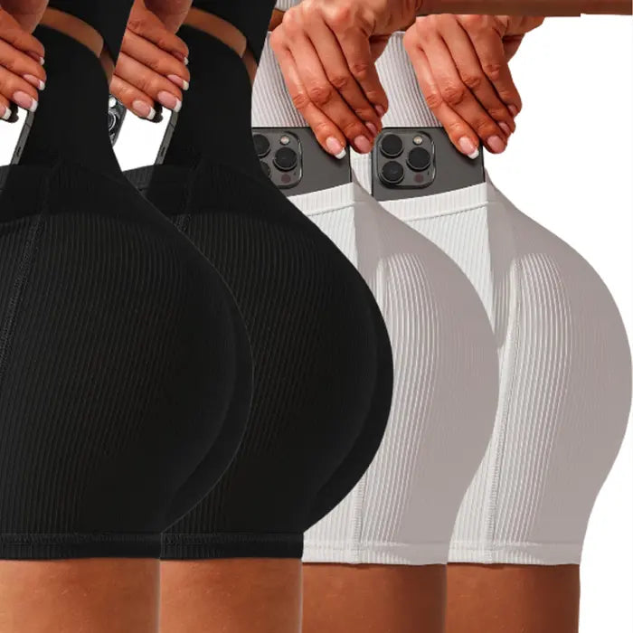 Yoga shorts set four-pack in black and white colors with phone side pocket and sculpting fit.