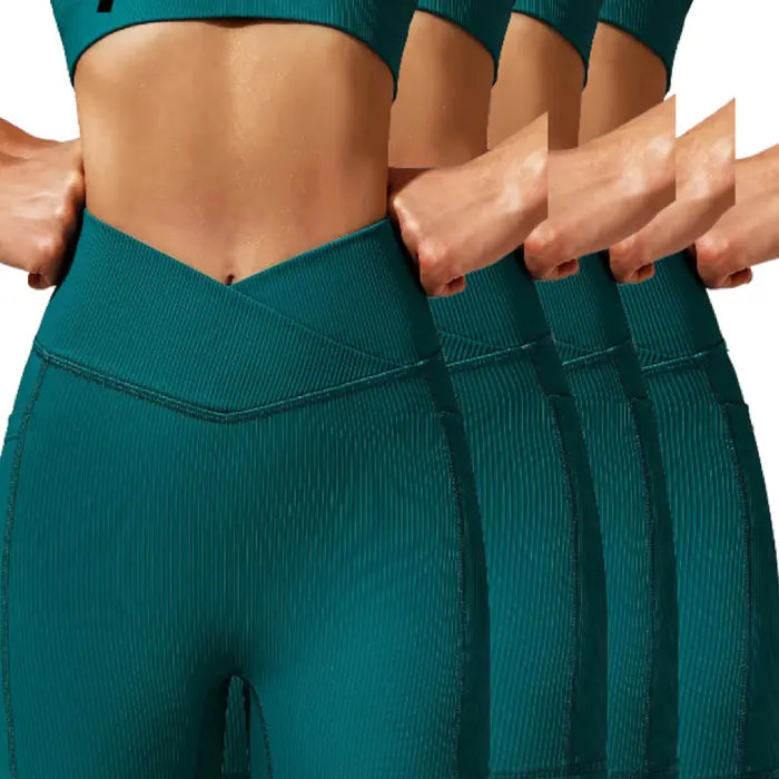 Yoga shorts set four-pack in deep green color with V-waistband and ribbed texture design.