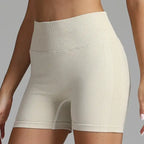 Yoga shorts women in beige tone with textured waistband and stretchy fabric.