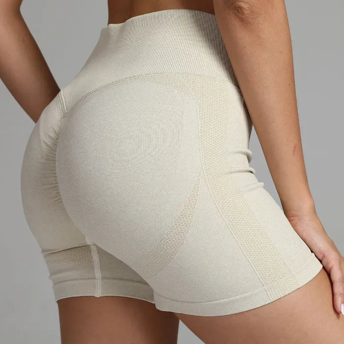 Yoga shorts women beige with sculpting seamless fabric for high-waist support and booty enhancement.
