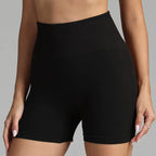 Yoga shorts women in black with high-rise waistband and body-hugging silhouette.