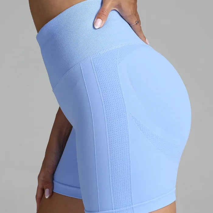 Yoga shorts women light blue seamless with high-rise compression fit and body-sculpting texture.