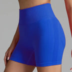 Yoga shorts women in bold royal blue with compression fit and breathable mesh panel.