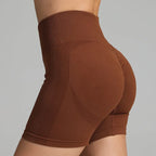 Yoga shorts women in brown with contour-enhancing fit and seamless mesh side detailing.