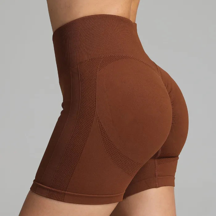 Yoga shorts women in brown with contour-enhancing fit and seamless mesh side detailing.