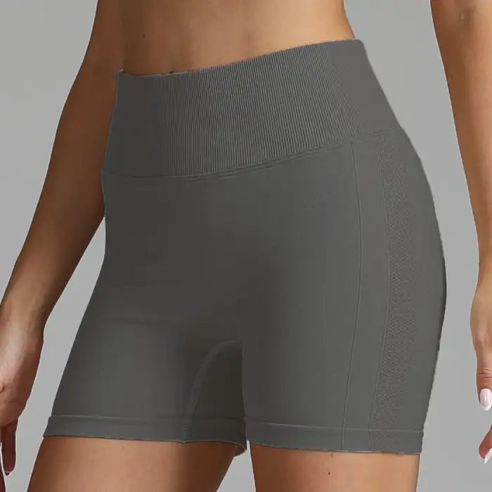 Yoga shorts women in dark grey with sleek look and supportive waistband design.