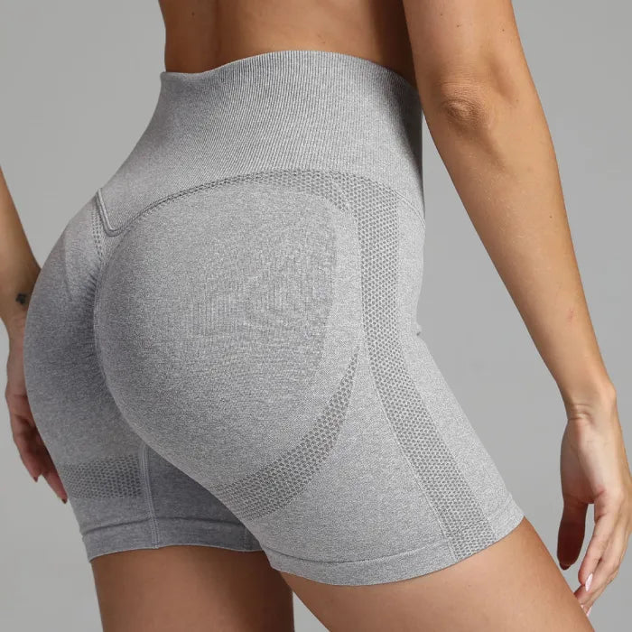 Yoga shorts women grey ribbed waistband and contour patterning for back support and body shaping.