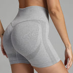 Yoga shorts women grey ribbed waistband and contour patterning for back support and body shaping.