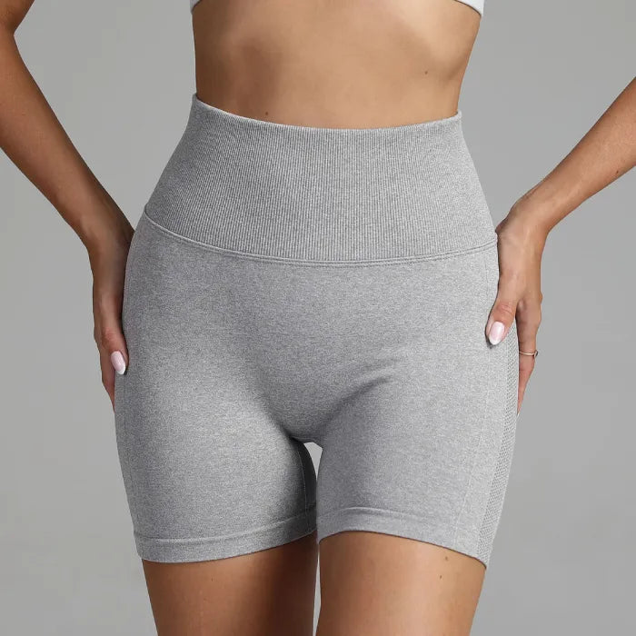 Yoga shorts women grey front view with wide ribbed high-waist for tummy control during fitness training.