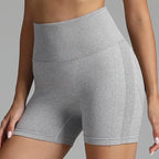 Yoga shorts women in heather grey with ribbed waistband and soft stretch fabric.