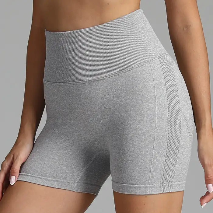 Yoga shorts women in heather grey with ribbed waistband and soft stretch fabric.