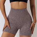 Yoga shorts women in maroon heathered design with supportive ribbed waist and snug fit.