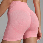 Yoga shorts women pink back view with seamless contour shaping and ribbed high waistband for support.