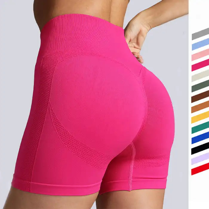 Yoga shorts women in hot pink color with high-waisted fit and contour detailing on back.