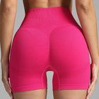 Yoga shorts women seamless hot pink design with contour shaping and sculpted back.