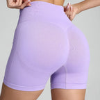 Yoga shorts women purple with gym-ready seamless structure and contour-enhancing back support.
