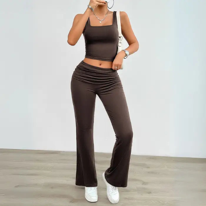Brown yoga two-piece set for women with a stylish crop top and high-waisted flared pants, great for fitness or casual wear.