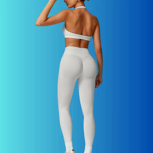 : Yoga Workout Set in light grey featuring open-back sports bra and seamless leggings viewed from the back.