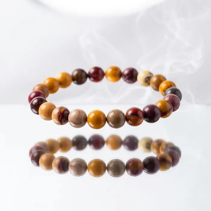 Yolk Stone Bracelet on wrist with polished tiger eye beads and natural stone pieces, stylish earthy jewelry for daily wear