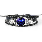 Zodiac Sign Bracelet focusing on bright Gemini charm with twin imagery, offering vivid celestial artwork in a stylish braided leather band.