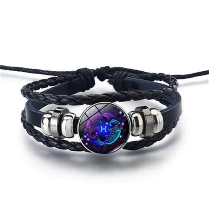 Zodiac Sign Bracelet with glowing Pisces design in deep blue hues, presenting artistic astrology symbolism on a braided leather wristband.