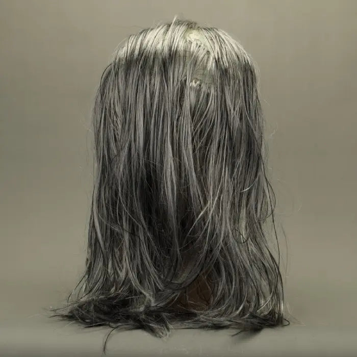Zombie face mask back view emphasizing long gray hair and pale textured scalp.