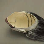Zombie face mask interior view with gray hair and foam structure for costume wear.